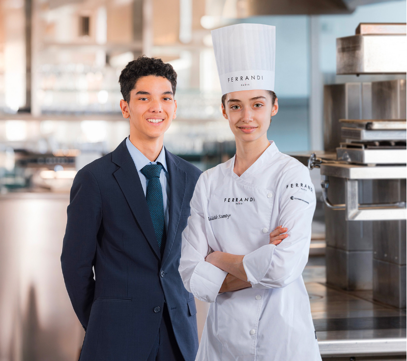 A FERRANDI Paris student presenting a plated dish