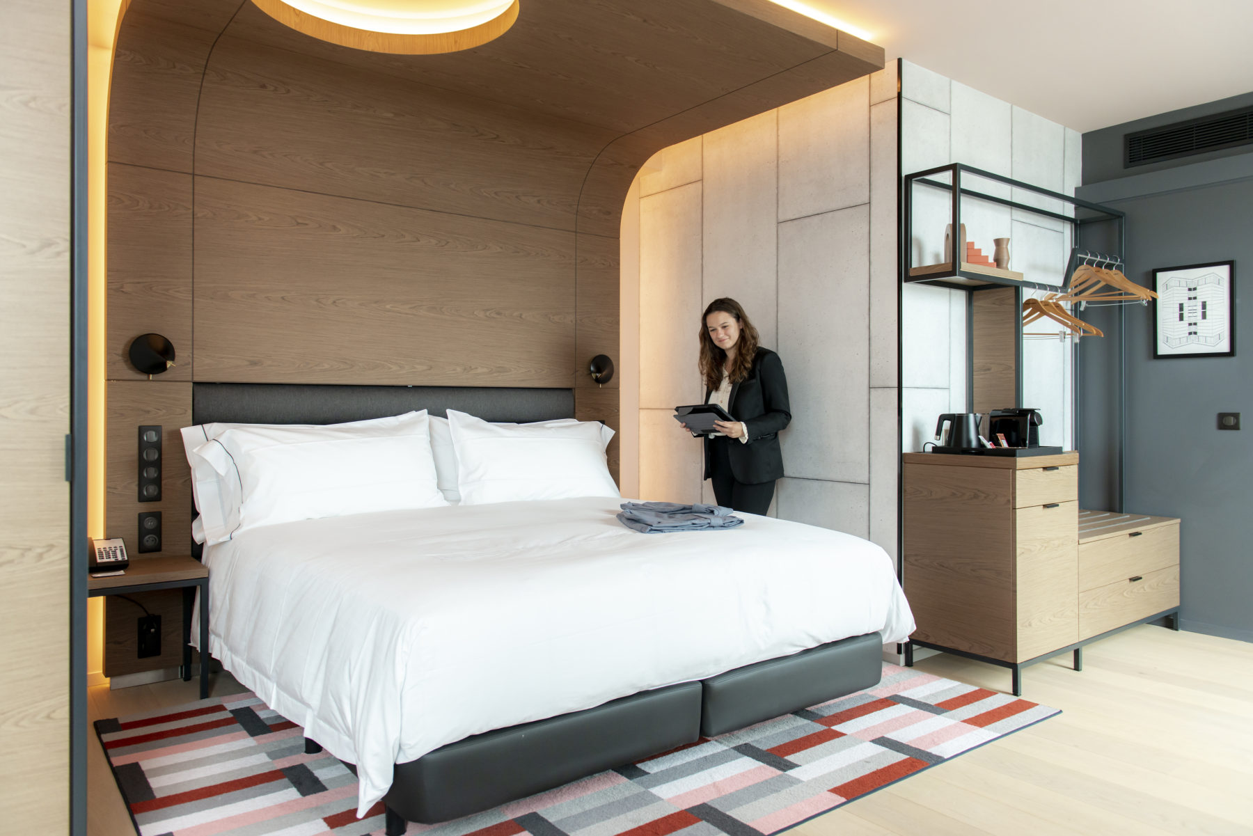 A hospitality student in a hotel room
